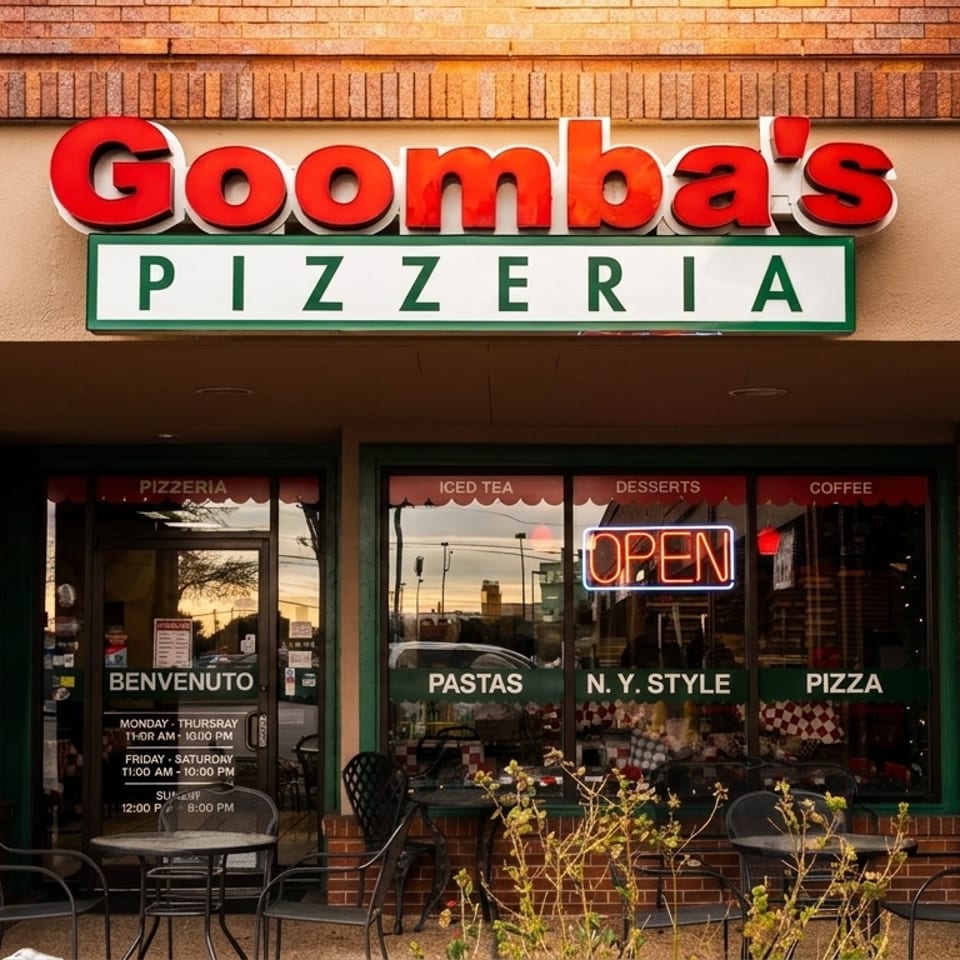 Goomba's Pizzeria storefront with an "OPEN" neon sign, outdoor seating, and menu details visible.